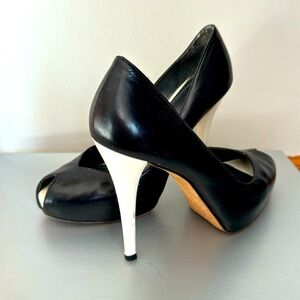 Black Stuart Weitzman beautiful heels with white heel and toe, size 8.5.